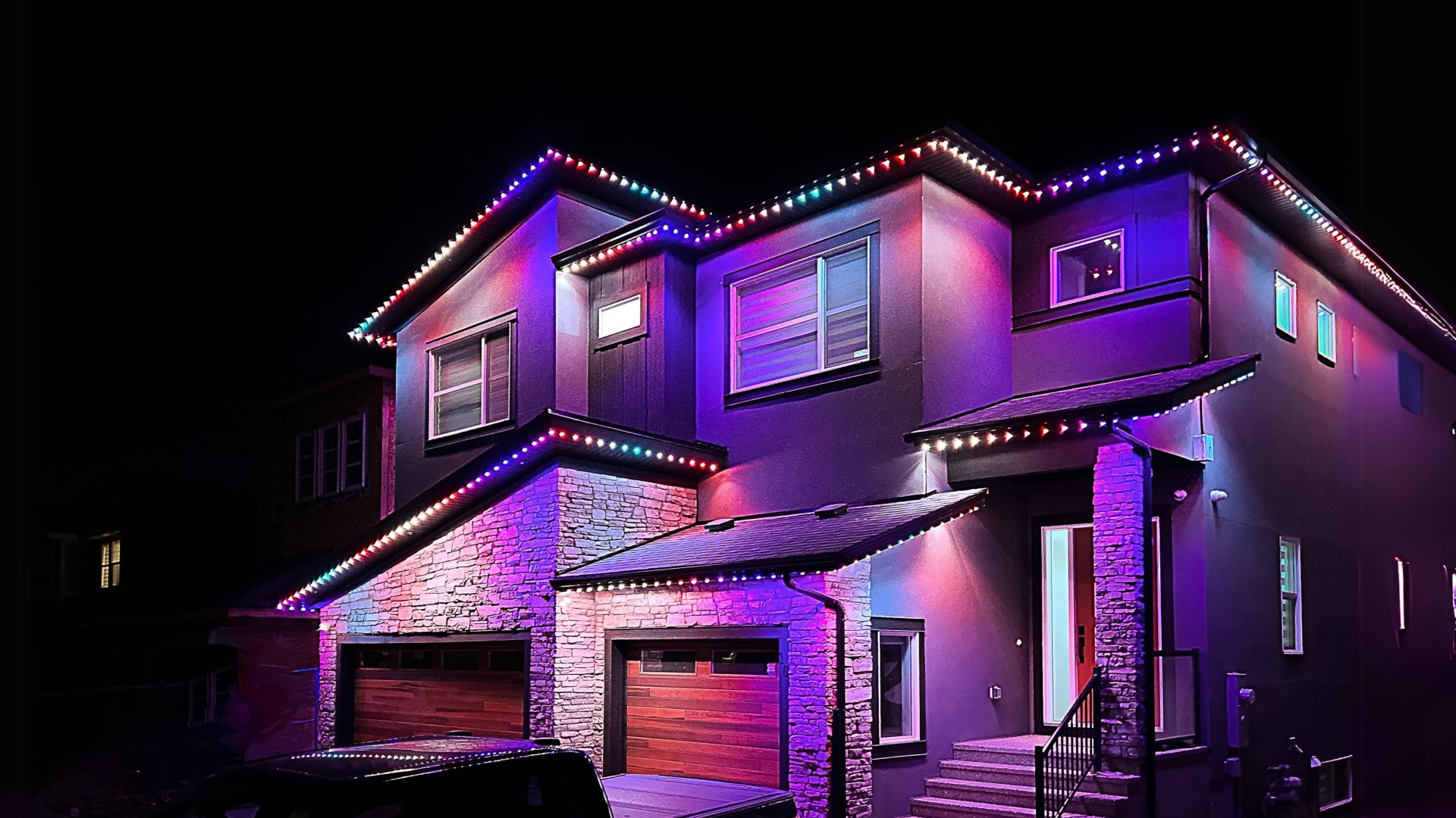 Calgary home with soffit lights showing holiday colours