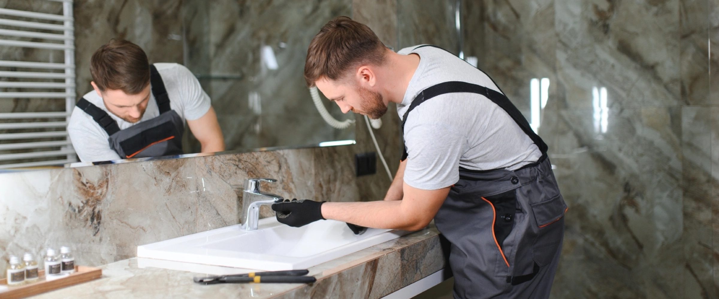 Tradesperson shaking hands with a customer beside a service van